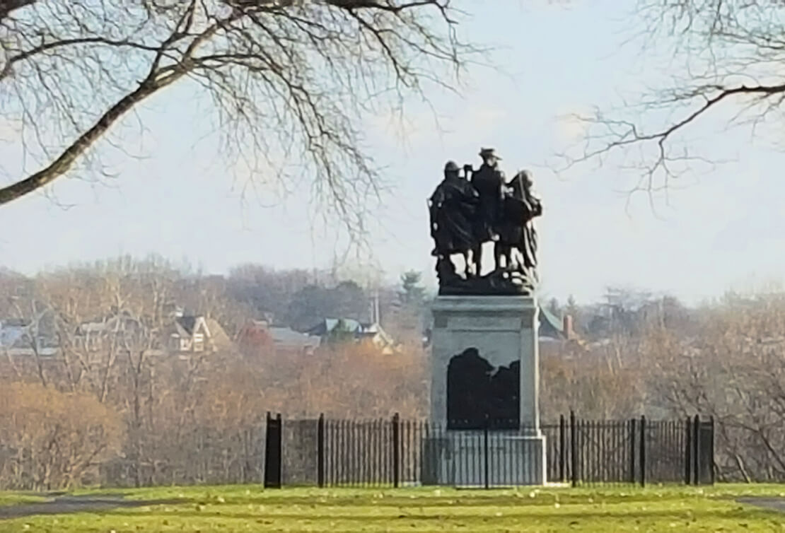 Fort Meigs statue overlooking the homes located on The Sanctuary on the River, new home community, in Perrysburg, Ohio. Maumee River land for sale for new home construction.